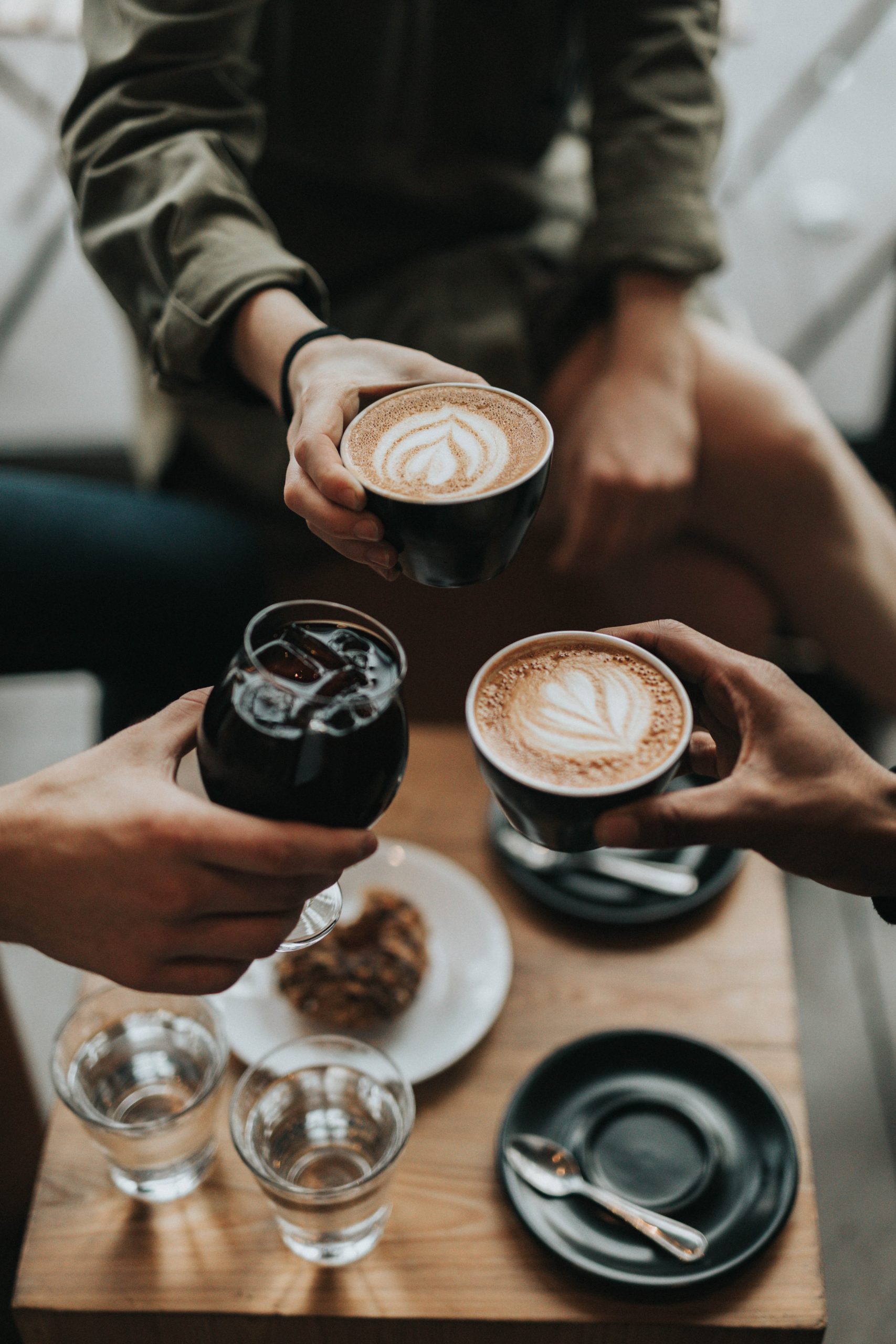 People drinking coffee and wine with ice